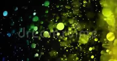 绿色渐变闪光的尘埃粒子从顶部黑色背景与波克流动的运动，绿色环境